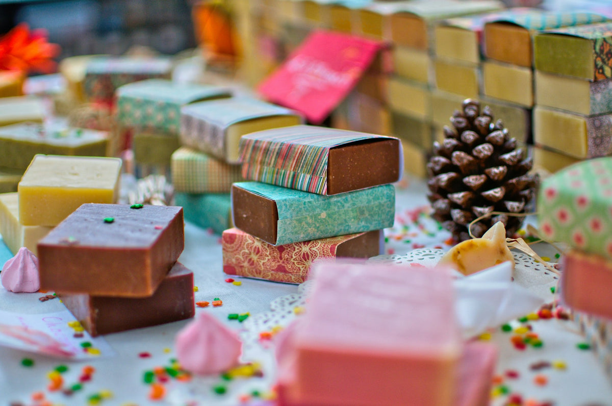 Colorful handmade soap bars wrapped in patterned paper