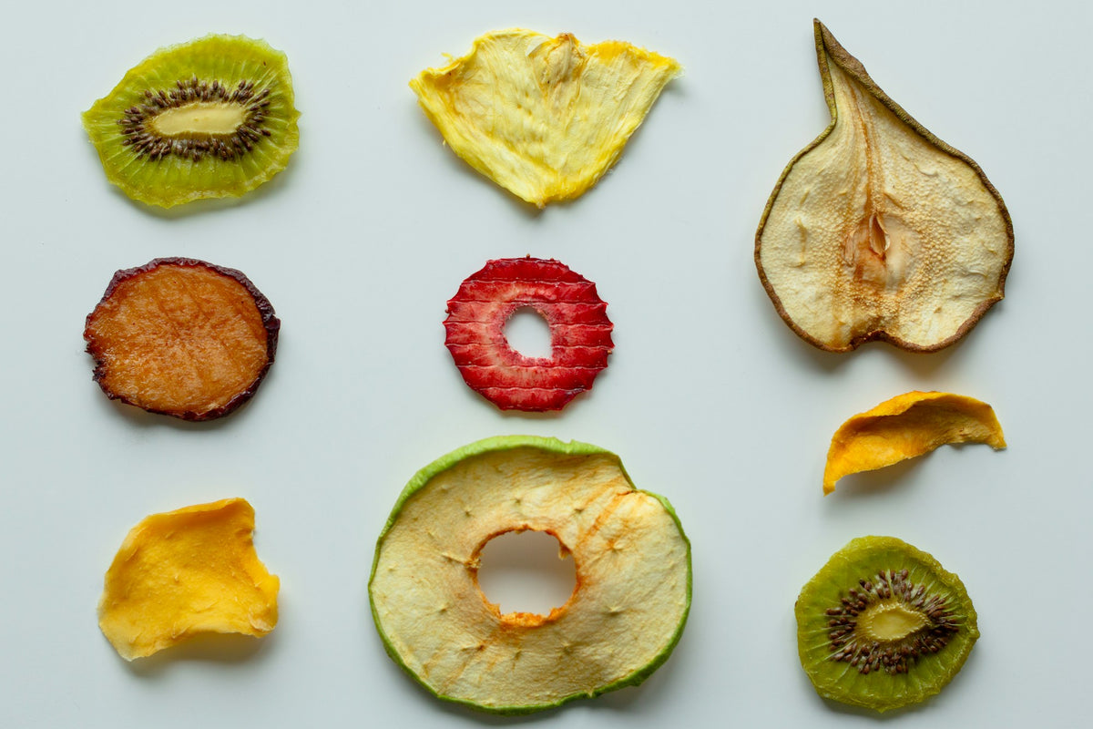 Colorful dried fruit slices: kiwi, strawberry, apple, pear and mango